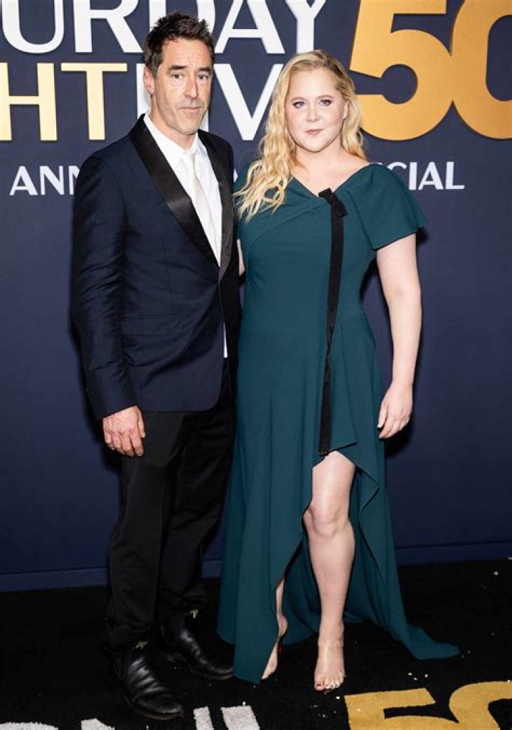 Amy Schumer & Husband Chris Fischer Kiss On Her 41st Birthday In Rare PDA Photos